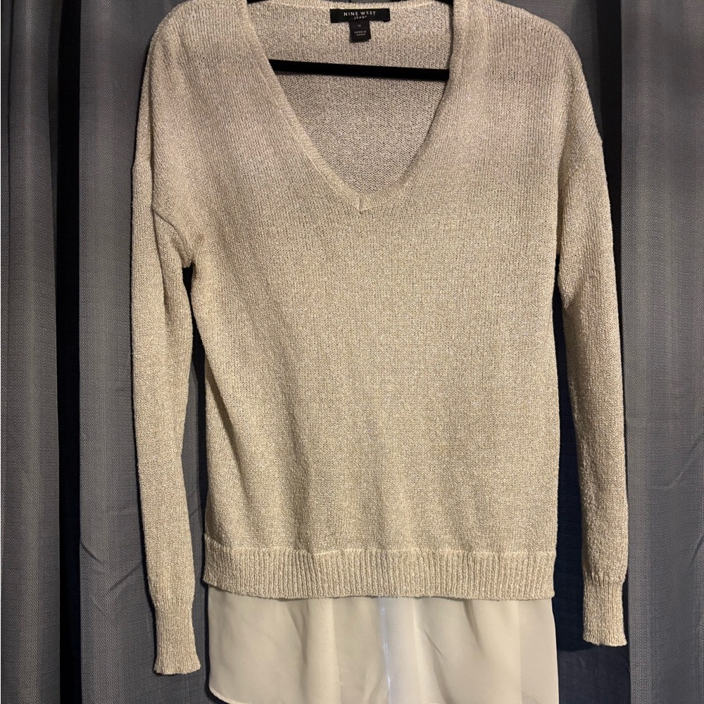 Cute sparkly off-white, silvery sweater.
